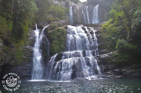 waterfalls spilling down the rocky mountainside