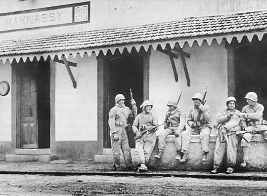 Men of the US 1st Armored Division at railroad station in Maknassy, Tunisia, 22 March 1943 (US Army Center of Military History)