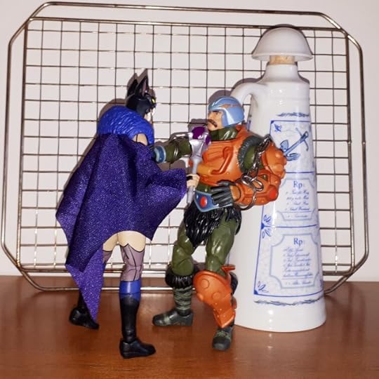 Evil-Lyn harasses the chained up Duncan.