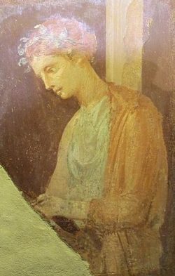 Young woman reading in Pompeii