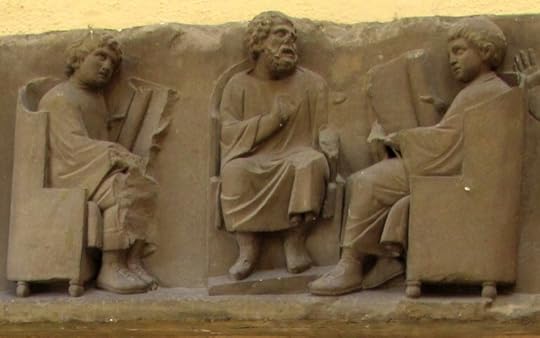 Carving of Romans reading