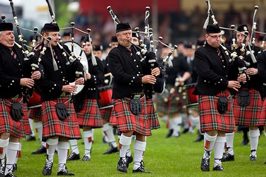 A group of Pipers playing the bagpipes near Glasgow in Scotland.