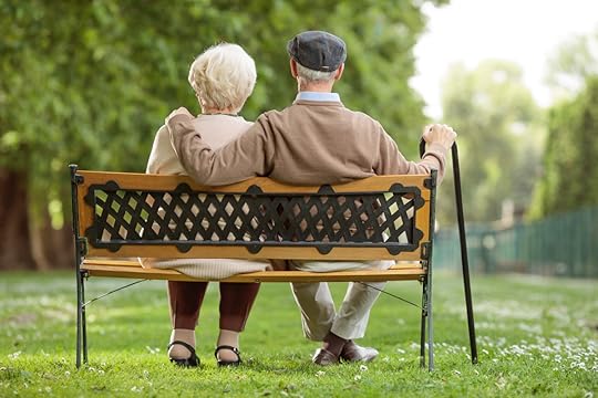 Elderly people sitting on bench.