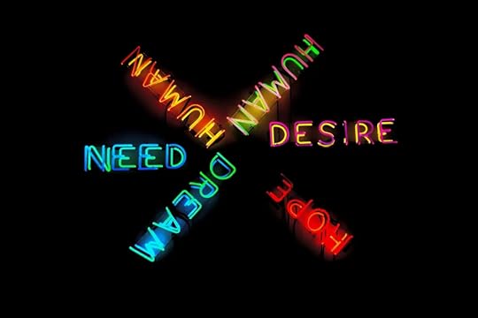 Image: a multi-colored neon sign artwork in which the words 