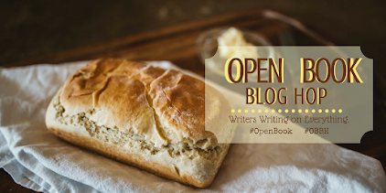 A loaf of homemade bread and the Open Book Blog Hope logo