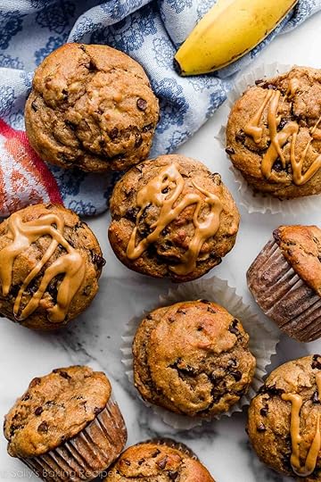 healthier peanut butter banana muffins with mini chocolate chips and blue linen napkin.