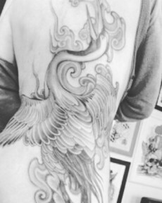 full-back tattoo of a crane