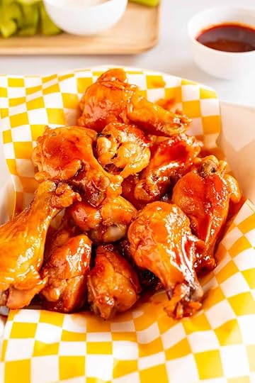 basket of fried chicken wings in brown sugar buffalo wing sauce