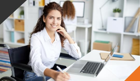 two women in an office with one woman in the forefront at a desk practicing effective management