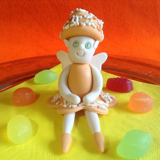 A pale skinned fair in a pale peach dress, hat and shoes.