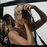 a woman hold a camera in front of her face