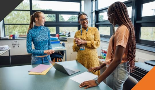 three female employees in an office meeting room enacting empathetic leadership