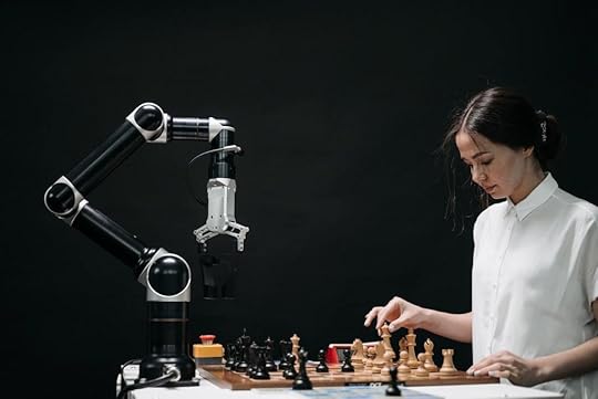 Robotic arm playing a woman in chess