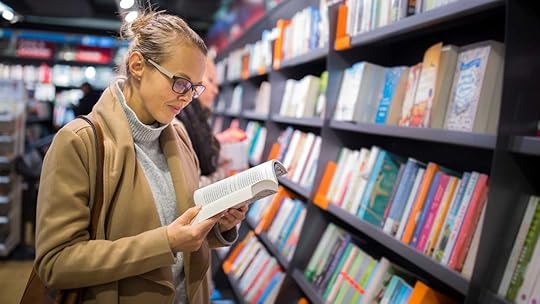 woman reading in bookstore