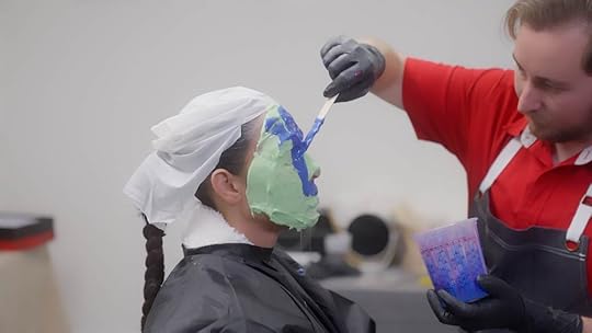Kim being lathered in silicone and plaster for the molding.