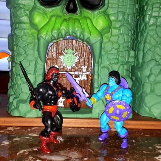 He-Skeletor fights Anti-Eternia He-Man in front of Castle Grayskull