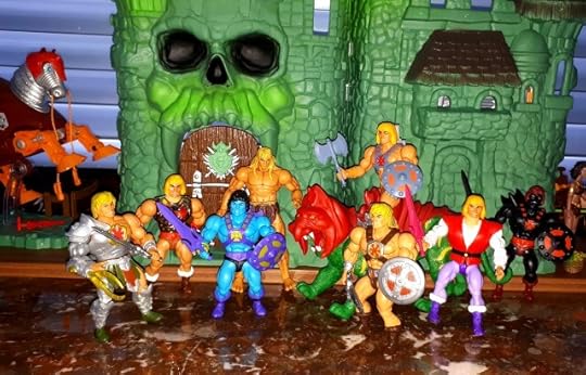 He-Skeletor stands in front of Castle Grayskull, surrounded by six different versions of He-Man.