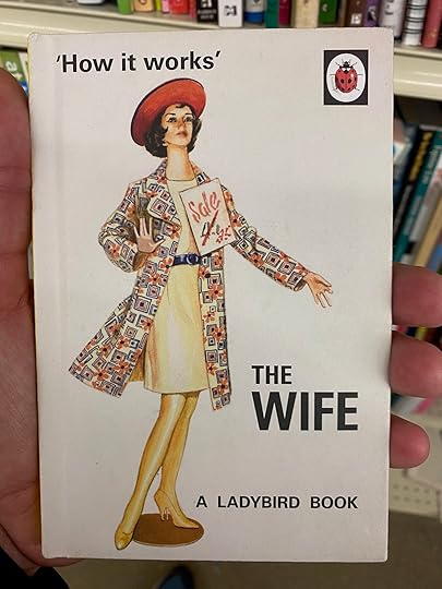 Me holding the book in Goodwill