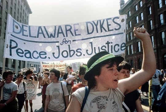 A color photo of women marching in a queer pride parade