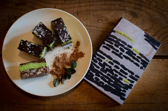 four mint nanaimo bars, beautifully plated if I do say so myself, next to the blackout version of query by zilla novikov