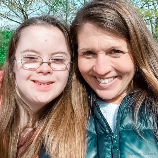 Penny and Amy Julia smile outside at the camera