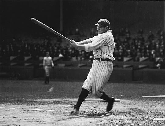 Black and white photograph of Babe Ruth swinging a baseball bat