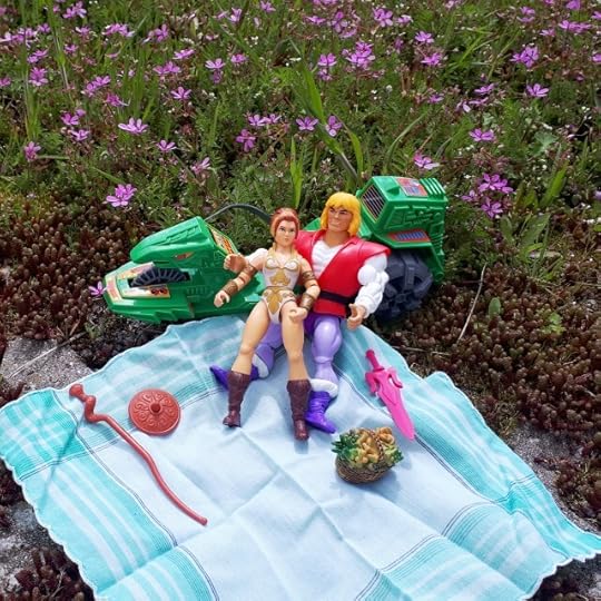 Adam and Teela are having a picnic and making out.