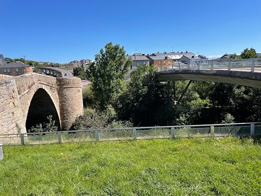 Two bridges span the river, one older and made of big stone arches, the other of concrete and steel stretching the whole distance
