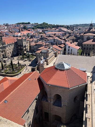 From a high vantage point, looking across perhaps hundreds of red terra cotta rooftops in Santiago, Galicia