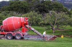 Concrete truck pouring concrete