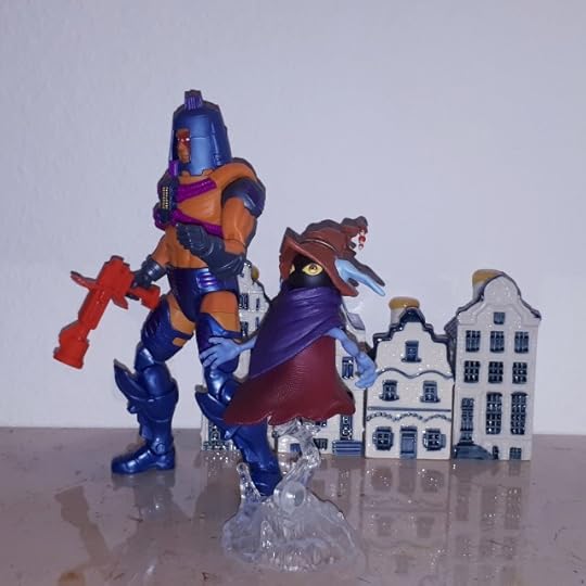 Man-e-Faces and Orko walk through the streets of Sarnscepter.
