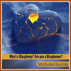 Cracked blue heart on blue sand