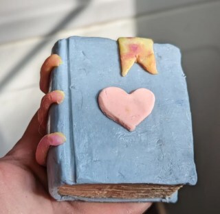 Bar of soap crafted to look like a little blue covered book, from Holiday Farm