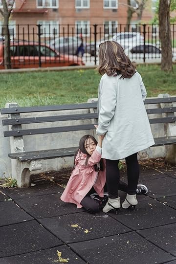 a woman holding a young girl while sitting on the ground Autistic and ADHD Girls In Early Childhood