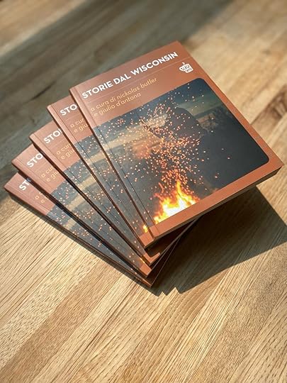 May be an image of fire, matchbook and text that says 'WISCONSIN BLACK 35SE CAFFEE STORIE DAL STORIE nickolas d'antona butler STO a cura qiulio e a e acur giu STO curo cur STO e giu cu gi ST'