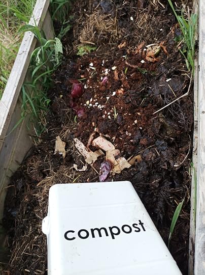 Adding kitchen and garden waste to a raised bed