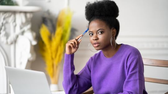 A woman at a laptop.