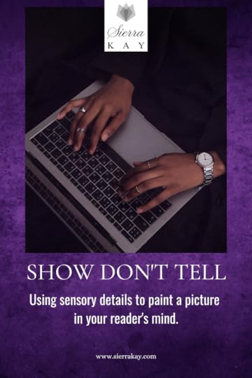 A woman typing on a laptop.
