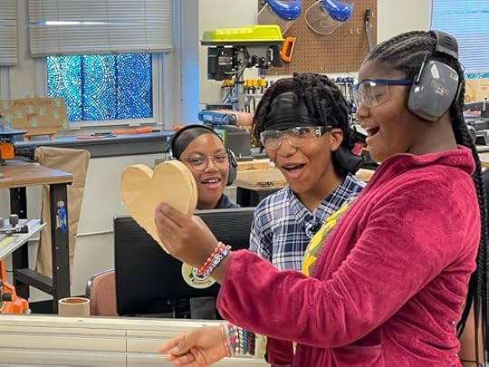 Students excited about a heart that they made