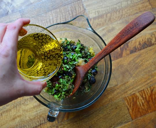 olive oil pouring on salad