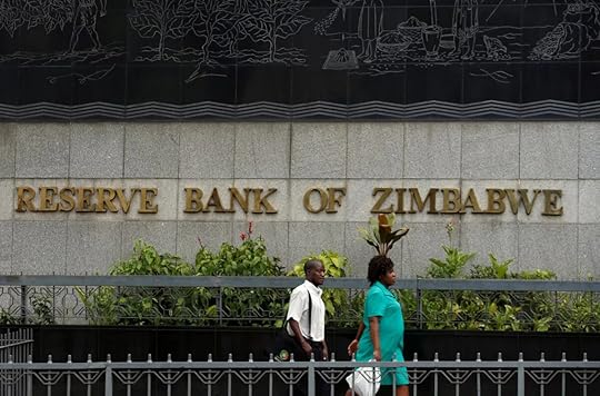 People walk past the Reserve Bank of Zimbabwe building in Harare, Zimbabwe, on Feb. 25, 2019. (REUTERS/Philimon Bulawayo/File Photo)