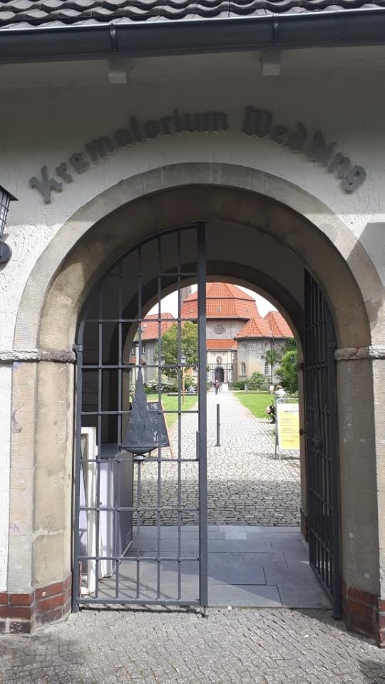 Silent Green cultural center seen through an archway