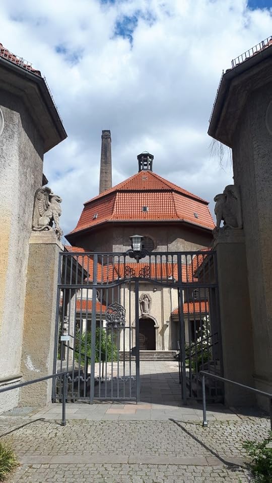 Domed Silent Green mourning hall seen through the gates