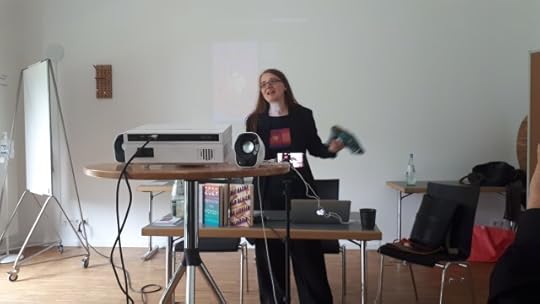 Emma Braslavsky waves a phaser around at Metropol Con