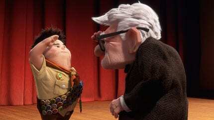 Carl from Up places a badge on Russel's scout sashee