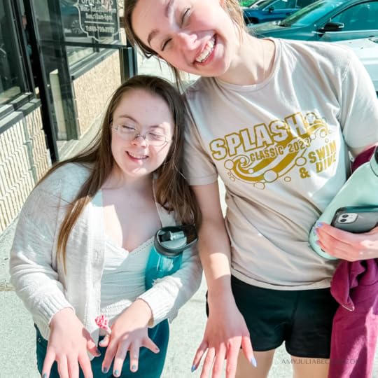 photo of Penny and her friend holding out their hands to show their nails