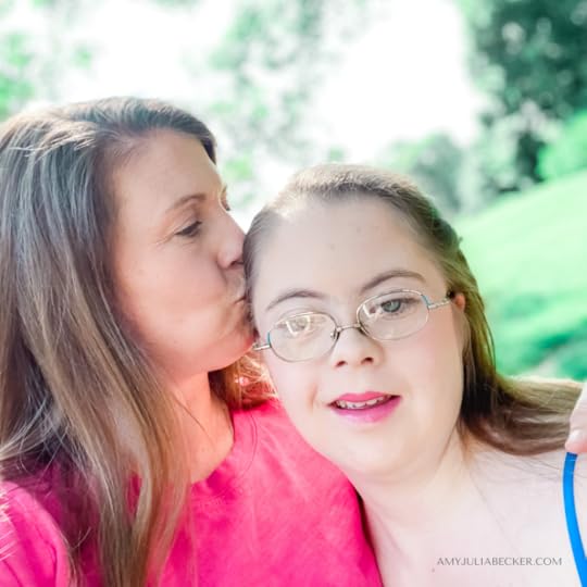 Amy Julia gives Penny a kiss on the top of her head as they stand outside and Penny smiles at the camera