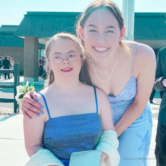 Penny poses with her friend at prom