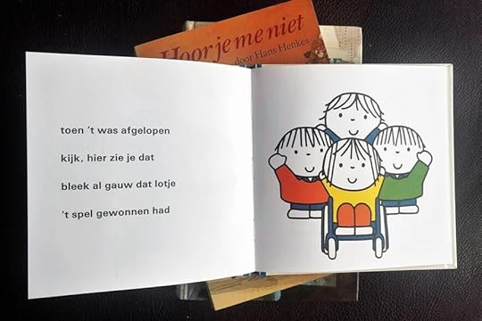 A group of happy children including one girl who is a wheelchair user