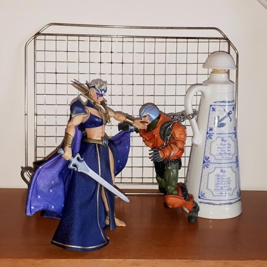 Lyn strokes the cheek of the chained up Duncan